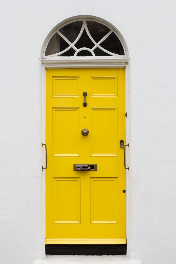 Bright yellow door for curb appeal. 